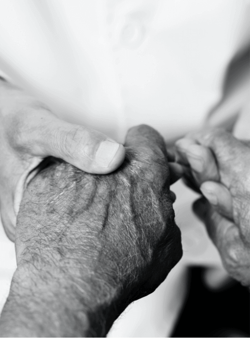 Image of two people holding hands